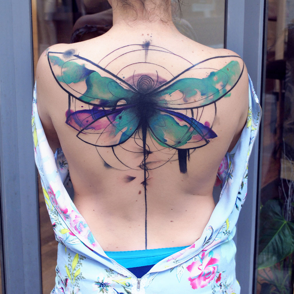 Abstract watercolor dragonfly tattoo